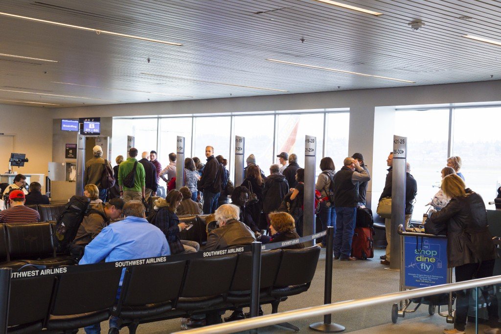 Portland, Oregon, USA - January 27, 2014: Travelers line up to get their flight rescheduled for a Southwest Airlines flight at Portland International Airport.