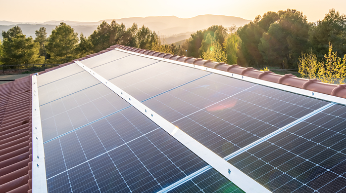 Solar panels on the roof of a House at sunset